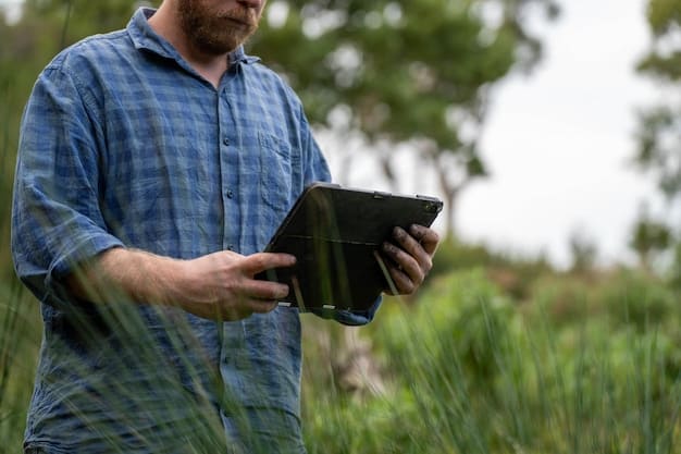 A farmer in the US using a tablet to view real-time data from soil sensors installed across their field. The data displayed on the tablet shows visualizations of soil moisture levels and nutrient concentrations.