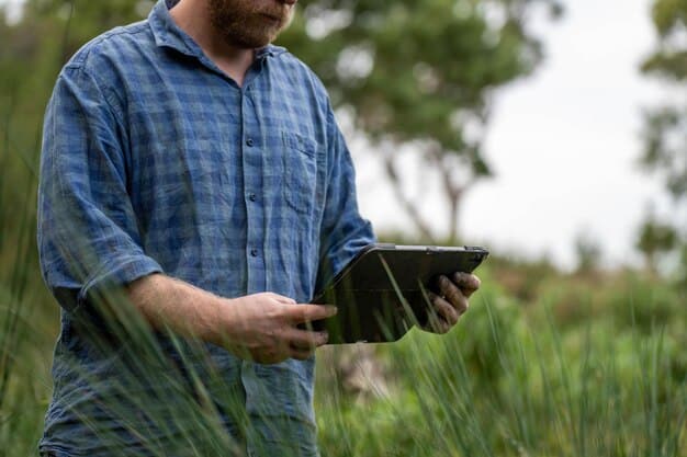 A close-up shot of a farmer using a tablet in a field, with a dashboard displaying real-time data on soil moisture levels, crop health, and weather forecasts. The background shows rows of crops stretching into the distance.