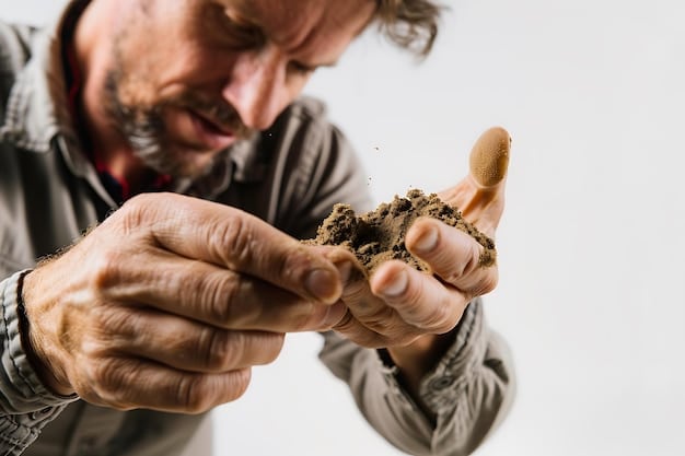 A farmer inspecting a handful of soil, demonstrating its rich, dark color and crumbly texture, indicative of healthy soil with high organic matter content. The farmer is smiling, suggesting pride in the soil's condition and the sustainable practices being used. Background shows a lush green field.