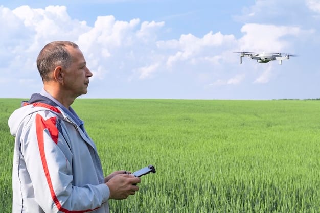 A close-up view of a drone hovering over a field, with spray nozzles clearly visible and actively spraying a fine mist onto the crops below.