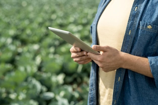 A detailed close-up photo of a USDA statistician reviewing data on a tablet in a field of organically grown soybeans, with a focus on data accuracy and real-time analysis.