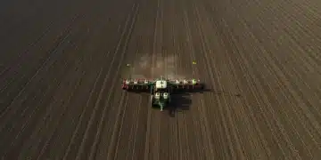 Precision Planting: 98% Seed Accuracy with GPS for Spring 2025 Modern precision planter with GPS technology in action on a large farm field