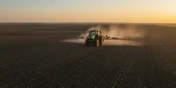 Tractor applying variable rate fertilizer on a U.S. farm field